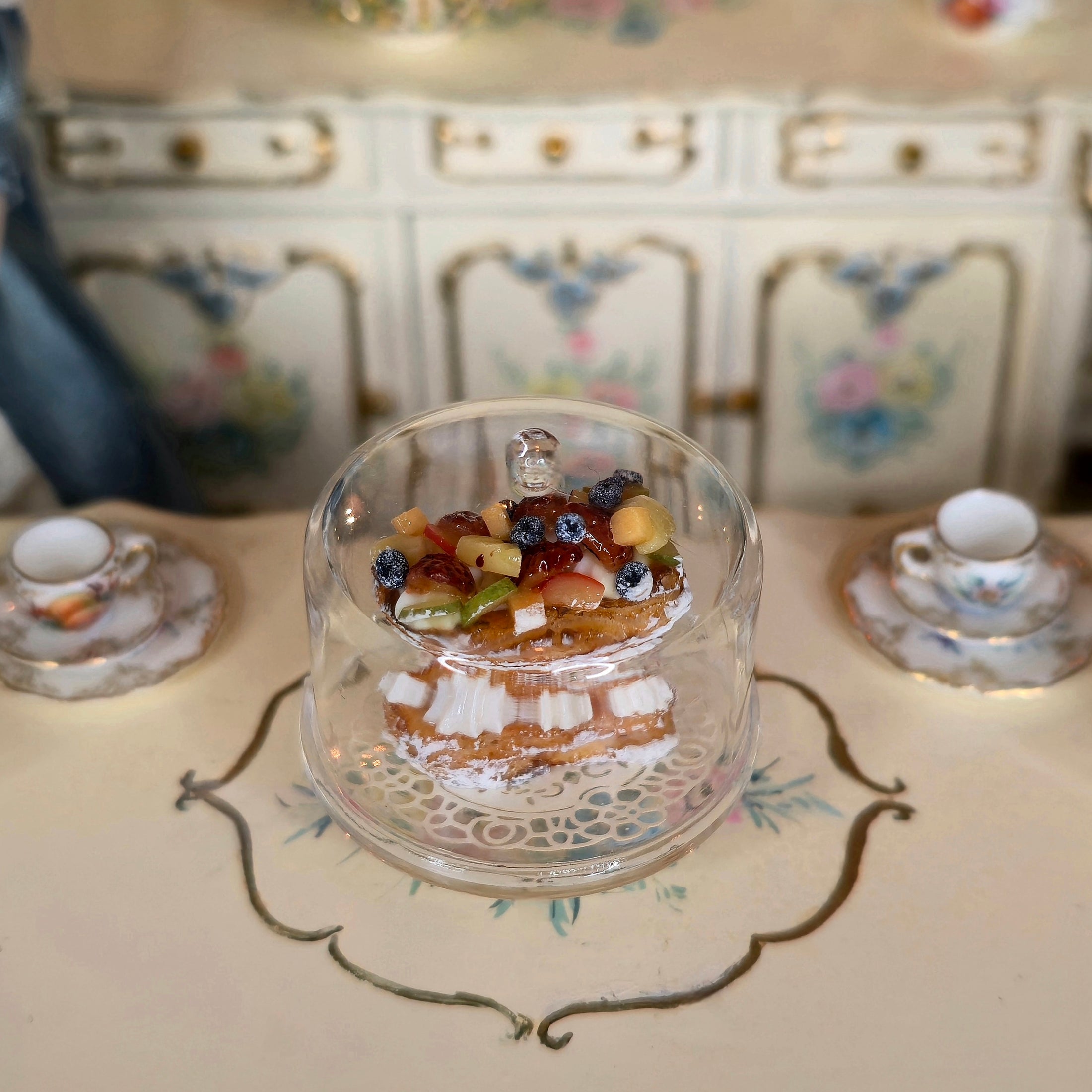 Small dessert in an acrylic container on a decorative table 