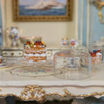 Load image into Gallery viewer, miniature dessert on a decorative table with a blurred background
