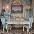 Load image into Gallery viewer, Miniature dining scene with a doll, table, chairs, and decorative elements in a detailed room setting.
