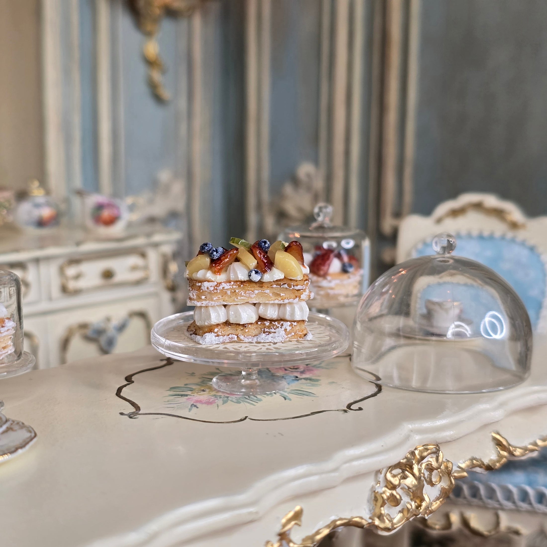 Delicate pastry dessert on a decorative table with ornate furniture in the background