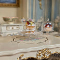 Load image into Gallery viewer, miniature cake on a cake stand with a classical interior setting
