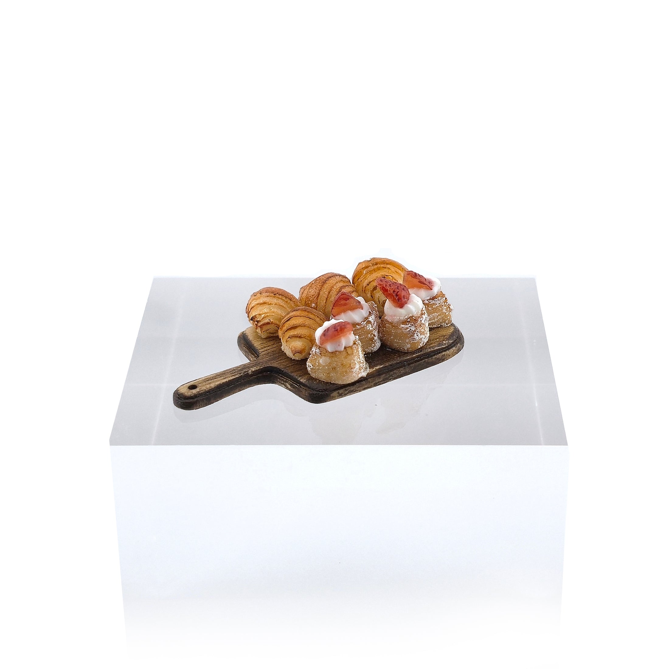 miniature pastries on a white background