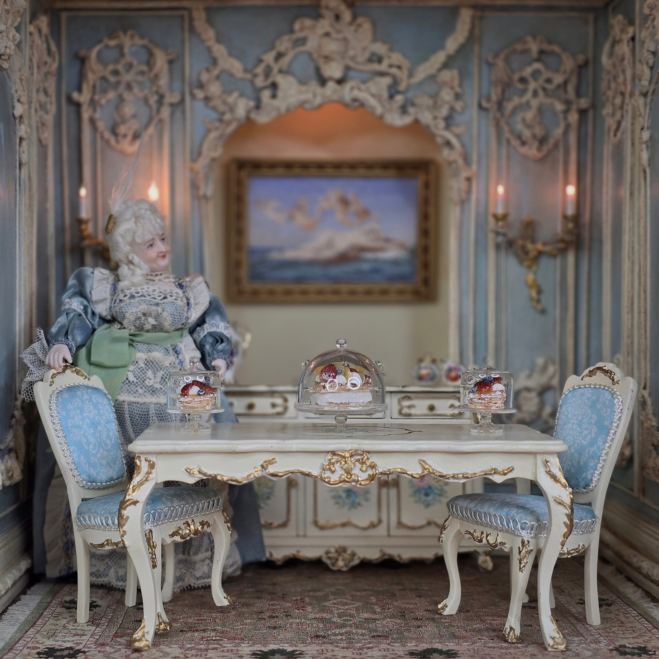 Decorative doll in a vintage-style room with ornate furniture and wall decorations.