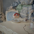 Load image into Gallery viewer, Small dessert on a stand on a table with a decorative background
