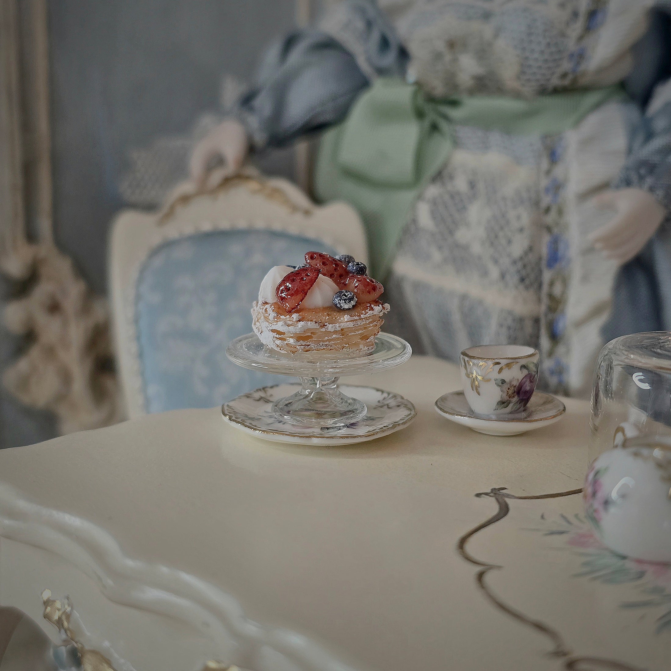 Small dessert on a stand on a table with a decorative background