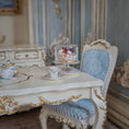 Load image into Gallery viewer, Miniature tea set and pastry on a decorative table with ornate chair in a detailed room setting
