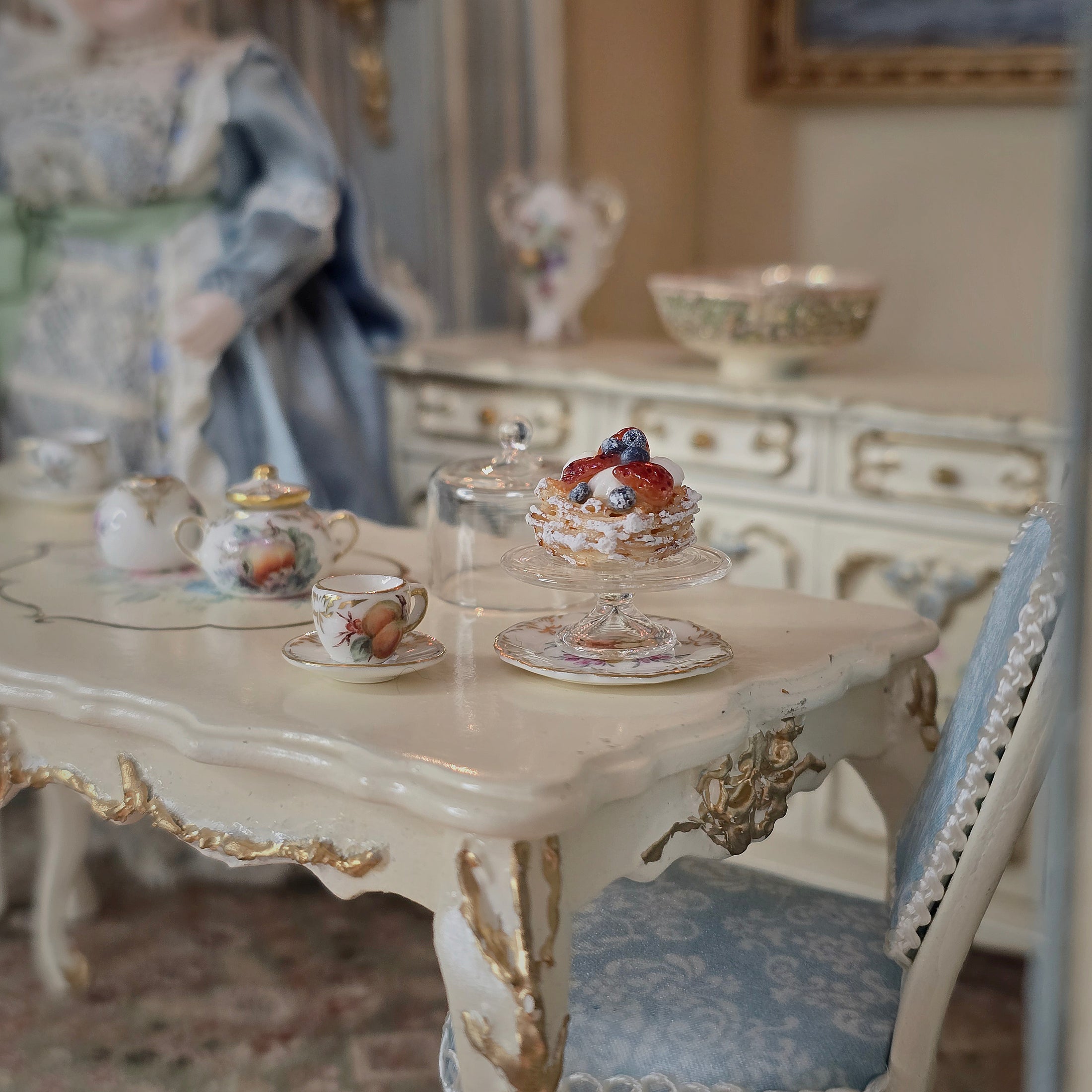 Vintage-style room with ornate table and decorative items
