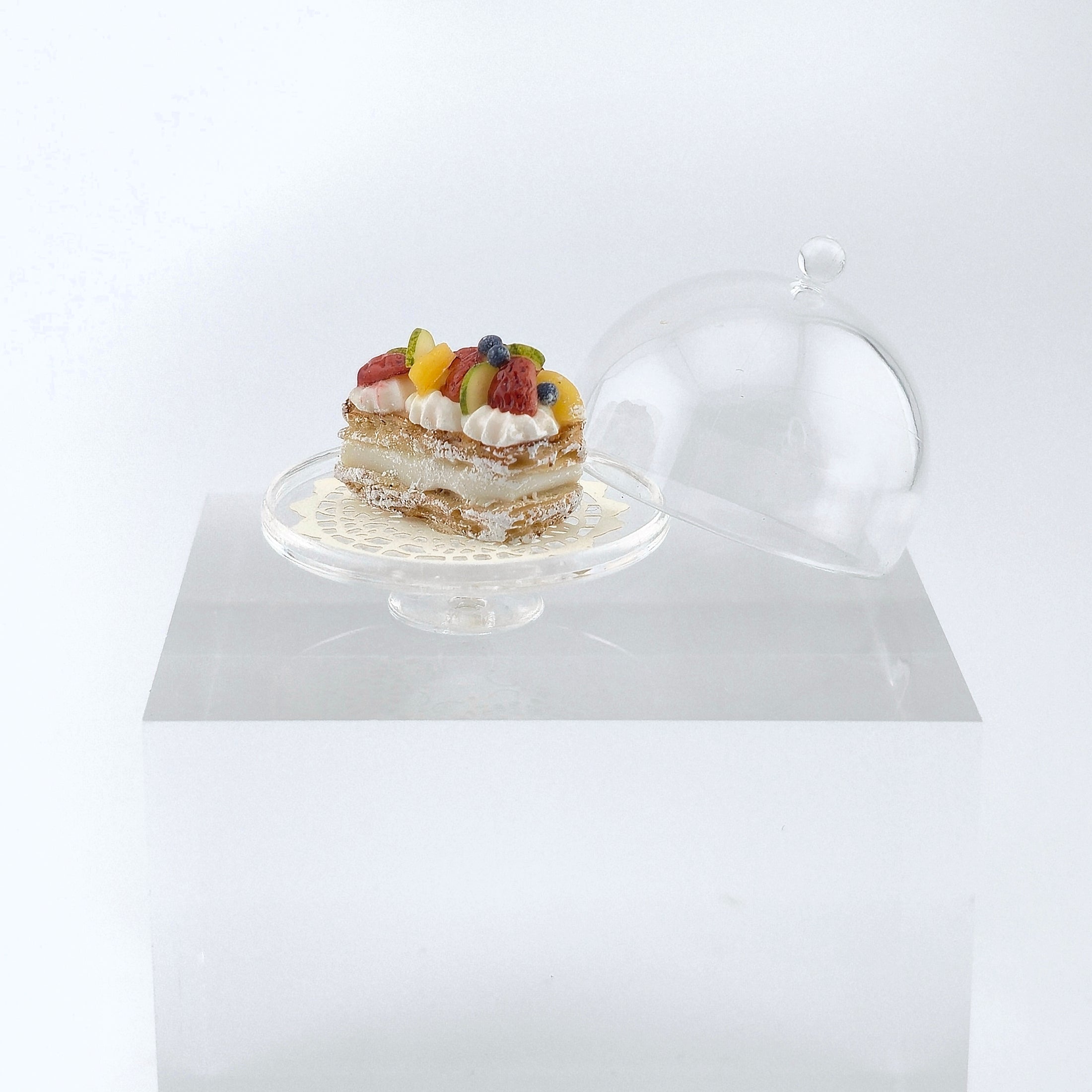 a miniature pastry with dome on white background