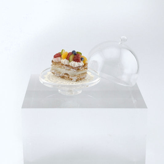 a miniature pastry with dome on white background
