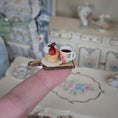 Load image into Gallery viewer, coffee & cupcake serving board, on finger
