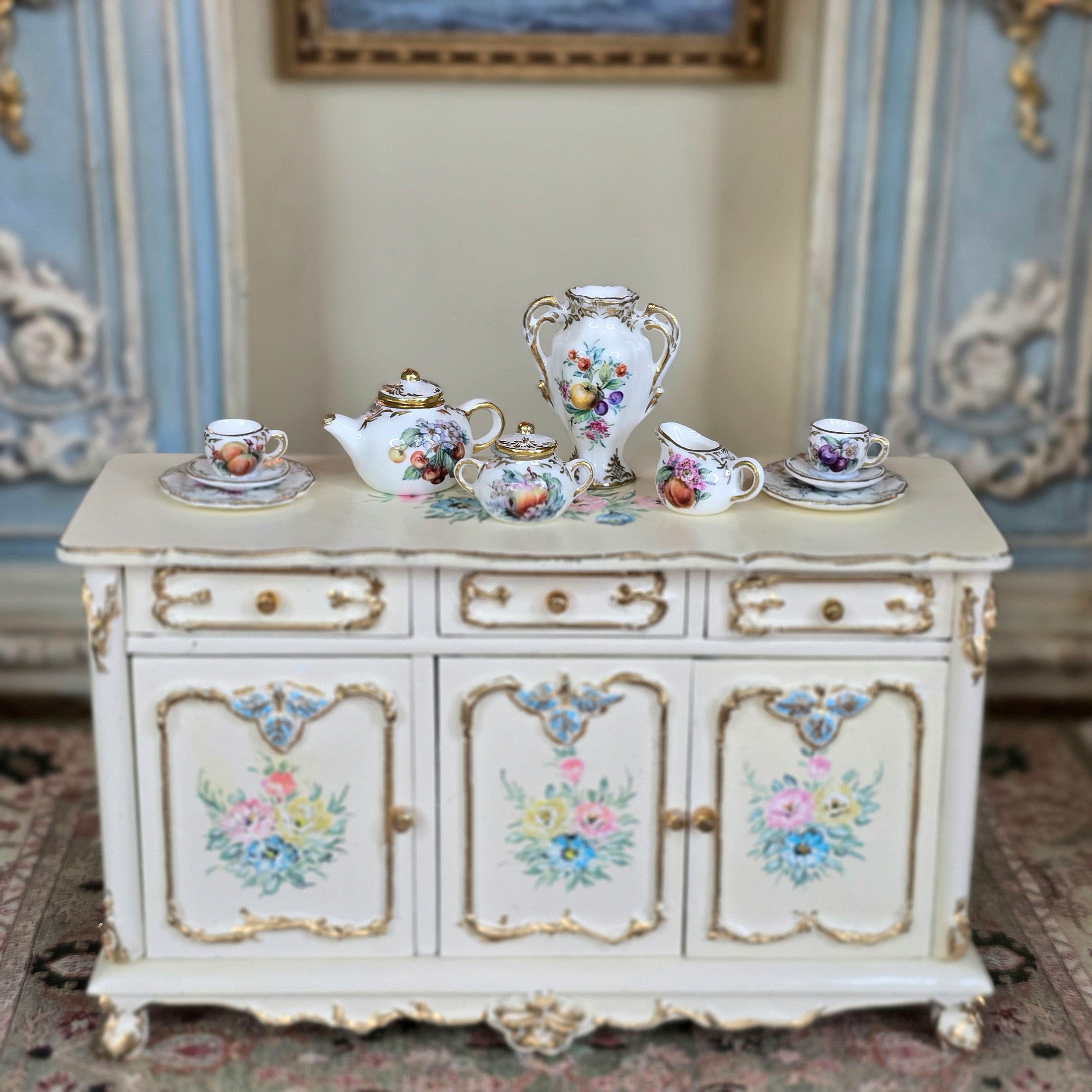 Vintage-style sideboard with decorative  Miyuki Nagashima painted tea service set on top