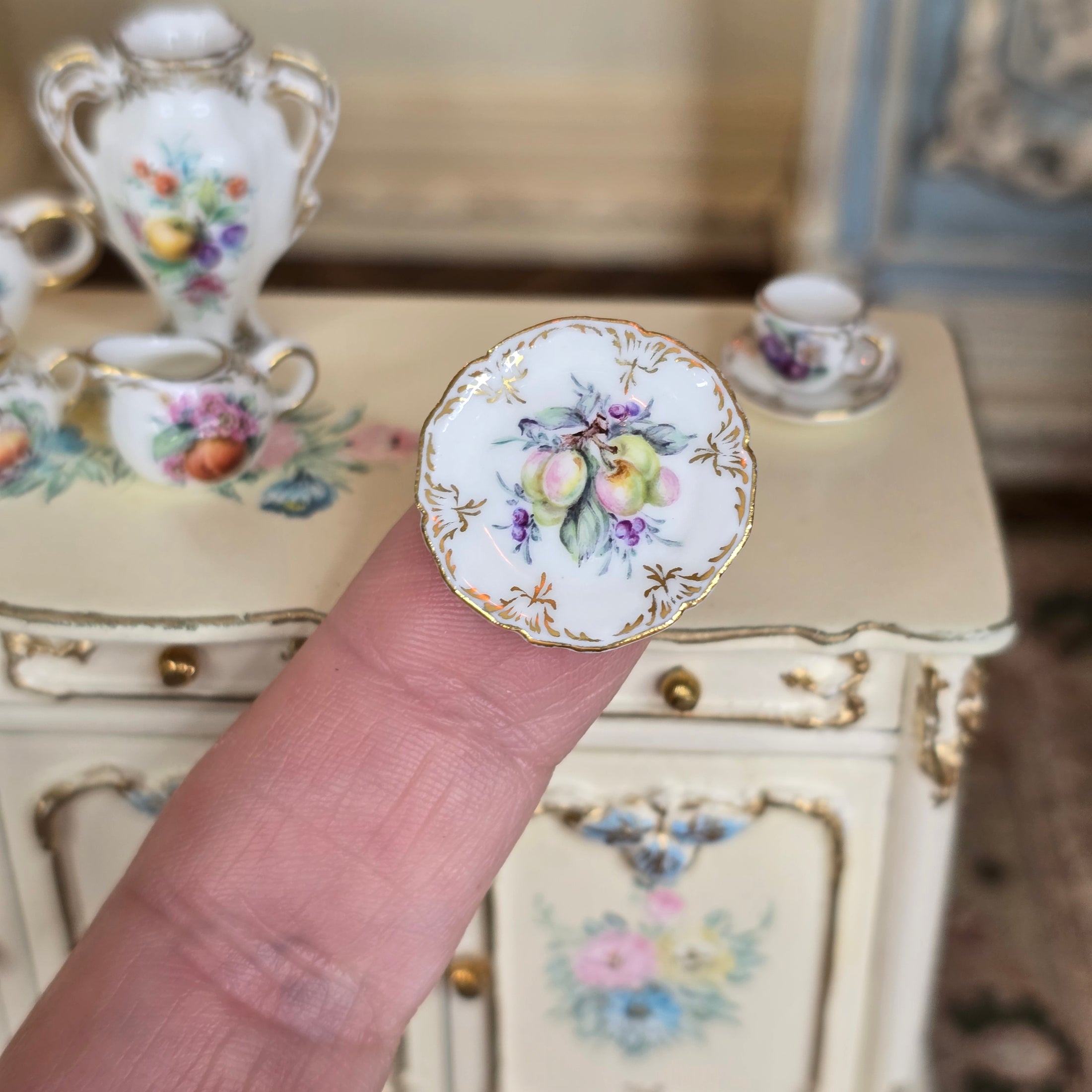 hand painted plums plate on finger, Miyuki Nagashima 