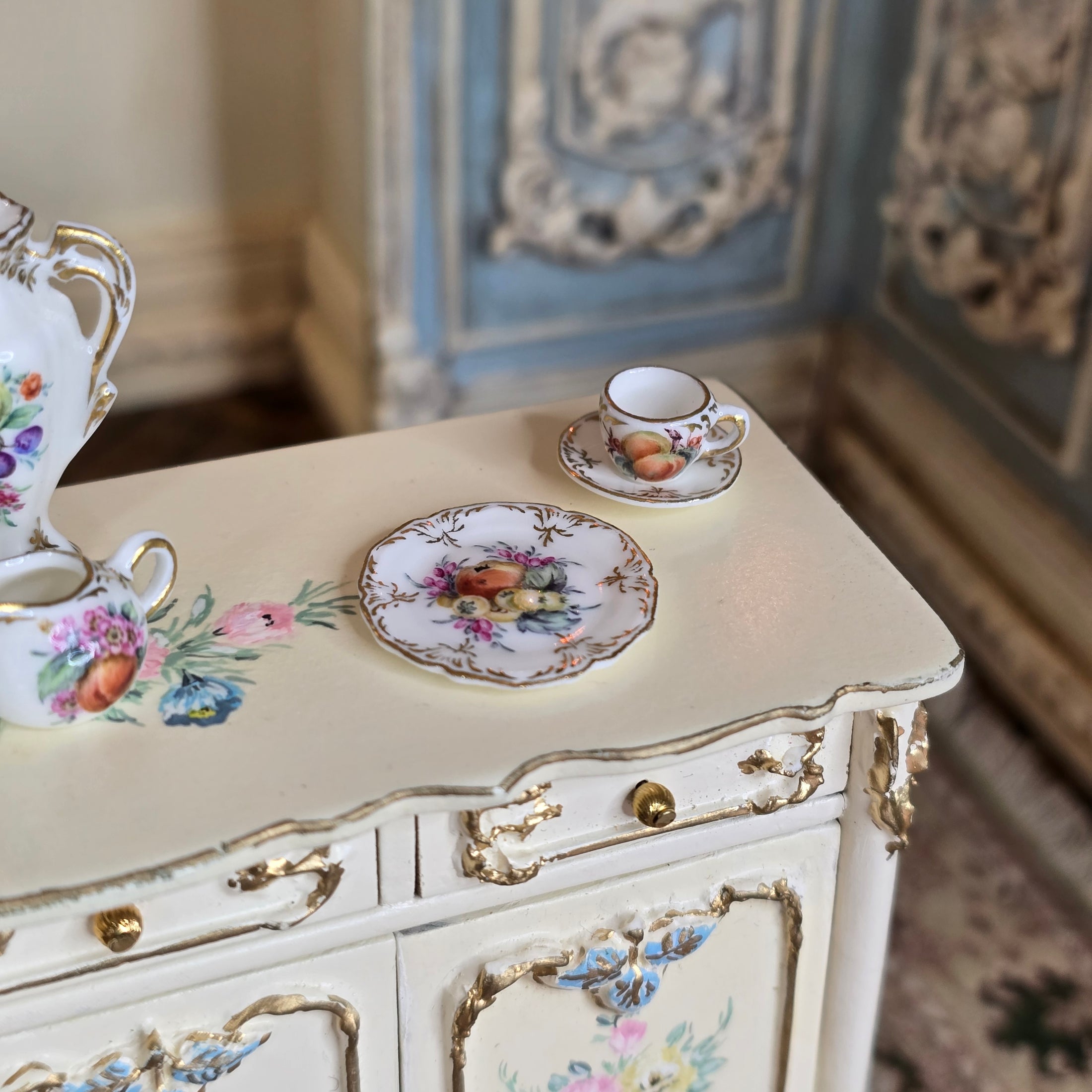 Hand painted Miyuki Nagashima porcelain set on buffet
