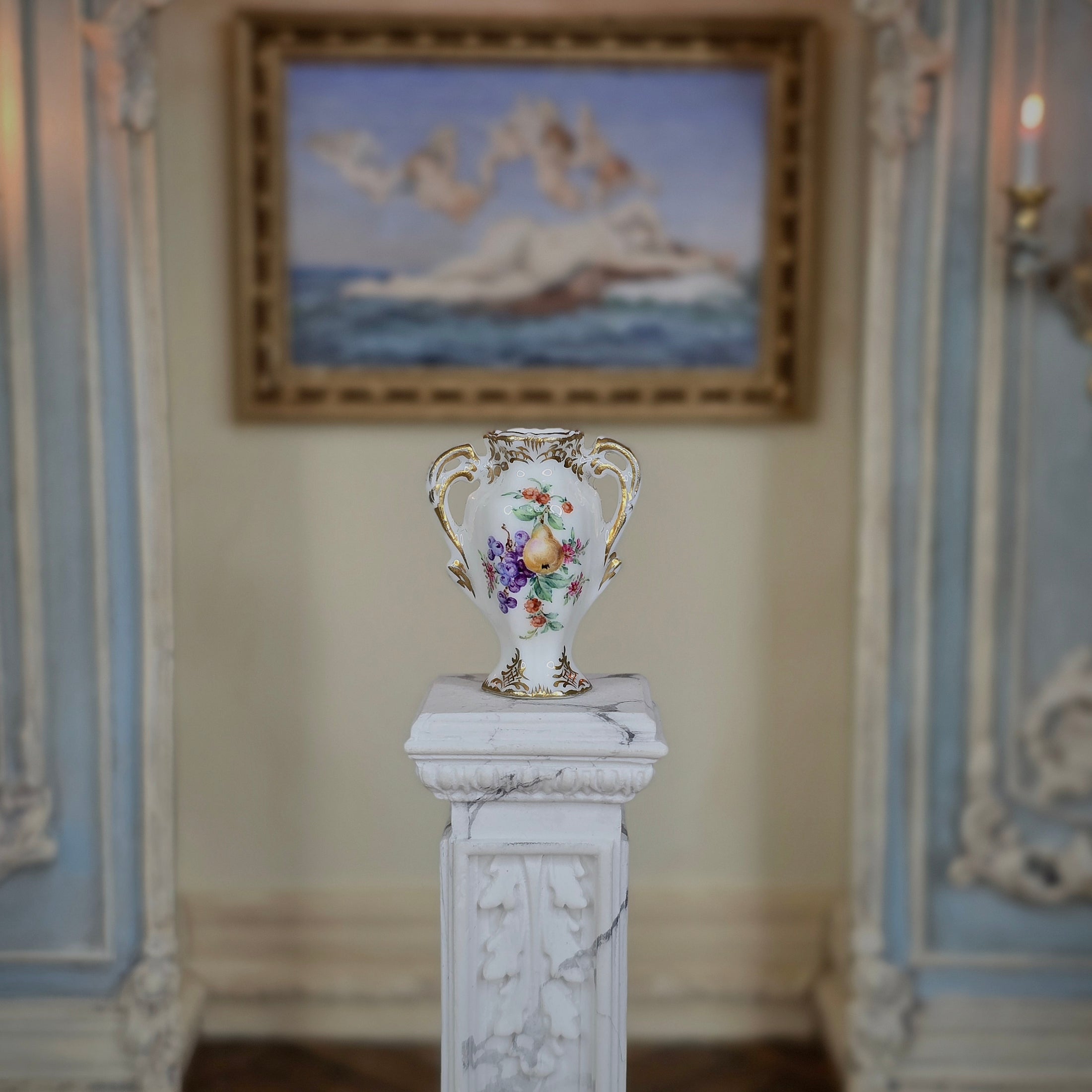 Decorative vase on a pedestal in an ornate room with a painting in the background