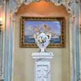 Load image into Gallery viewer, Decorative vase on a pedestal with a classical painting in the background

