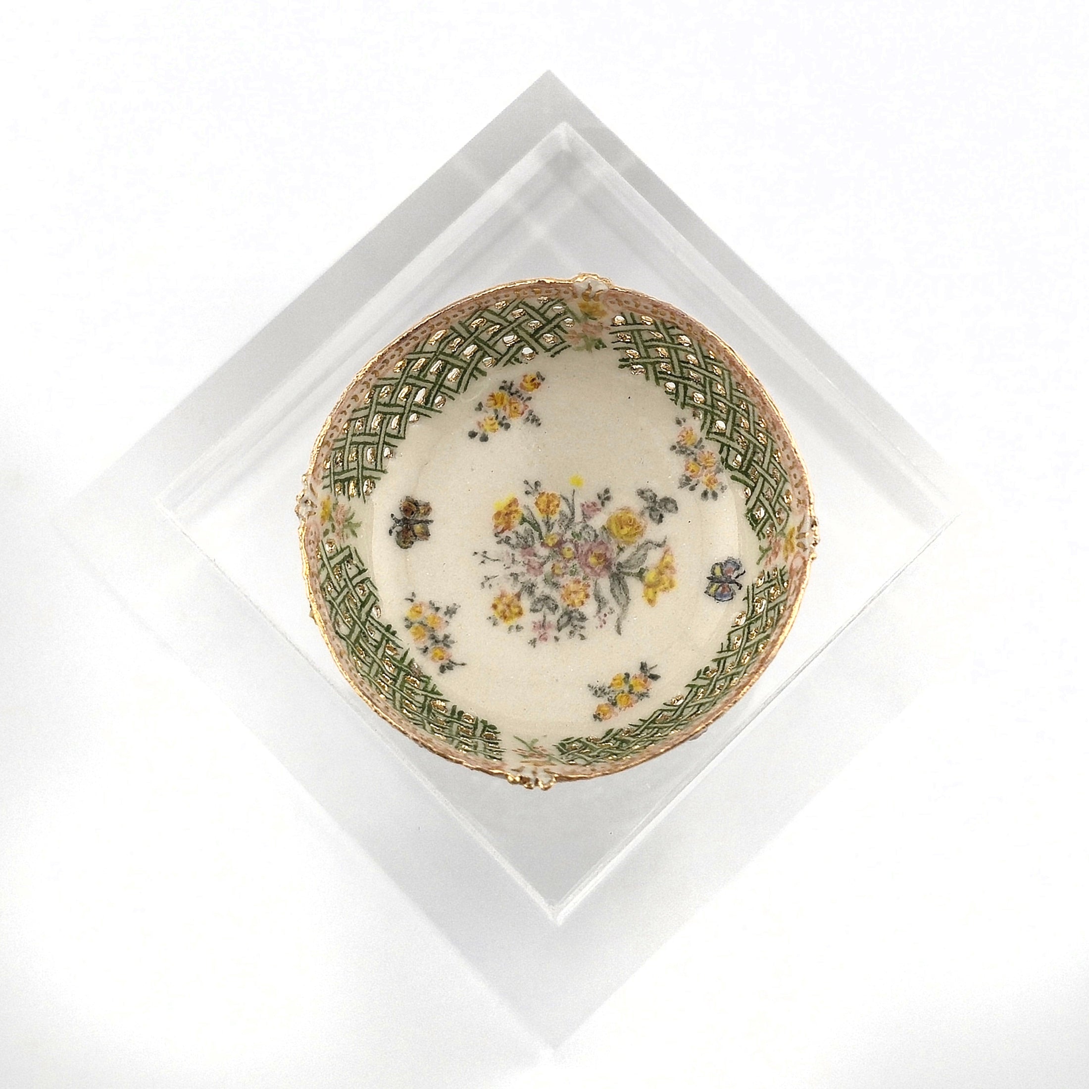 Decorative porcelain bowl with floral design on a white background