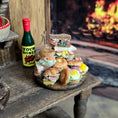 Load image into Gallery viewer, Stack of miniature sandwiches on a wooden table 
