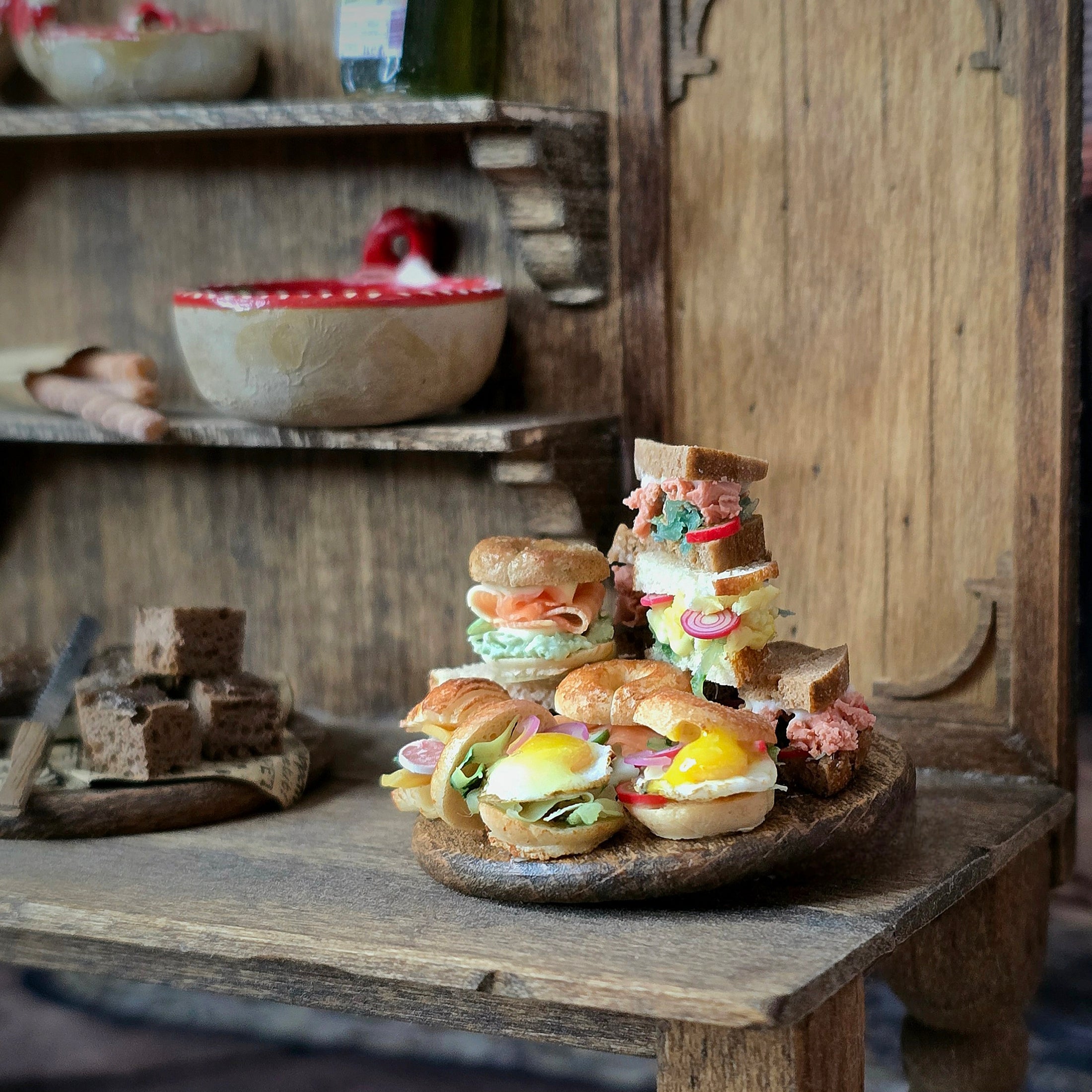 Assorted sandwiches on a wooden table with a rustic background