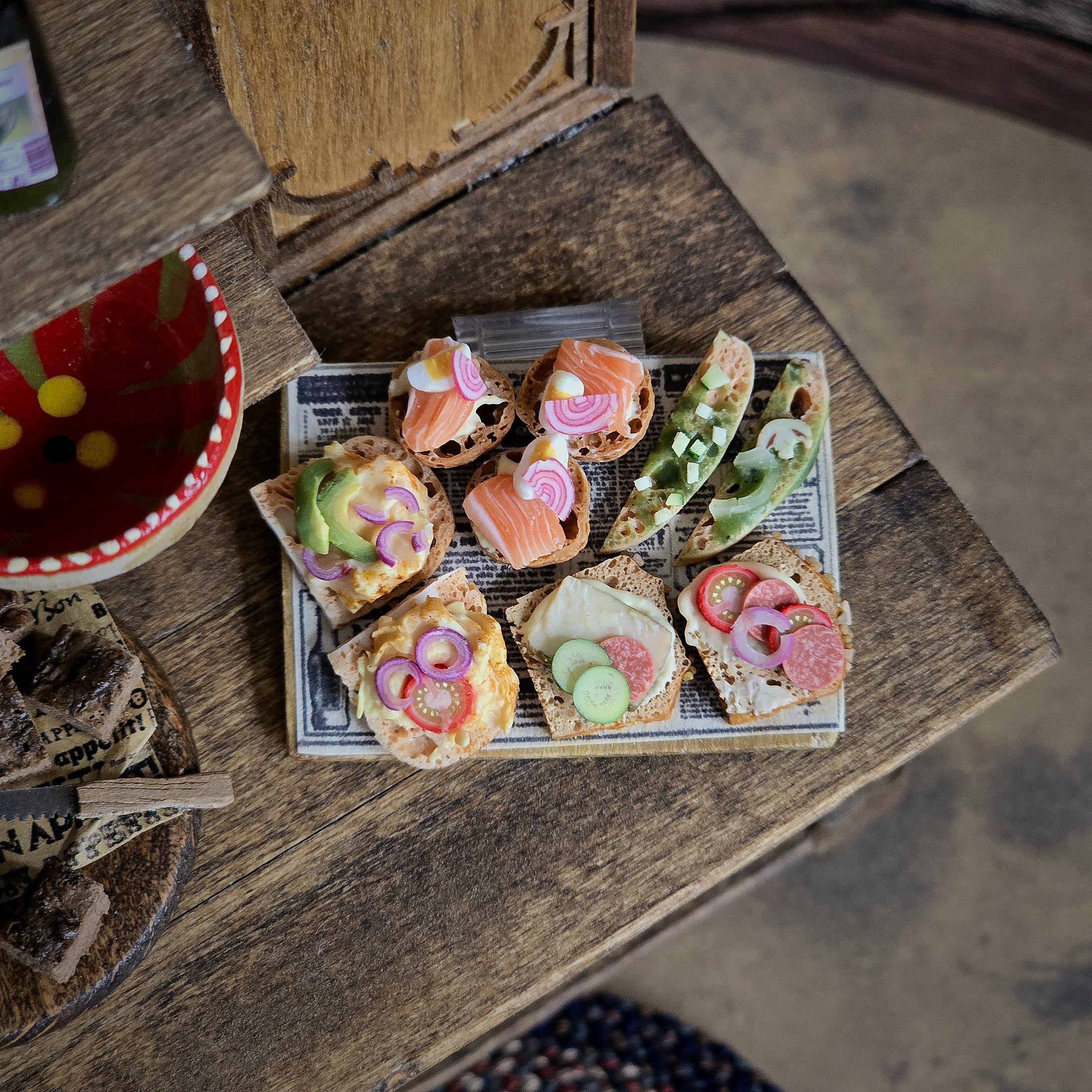 Miniature sandwiches on a wooden table.