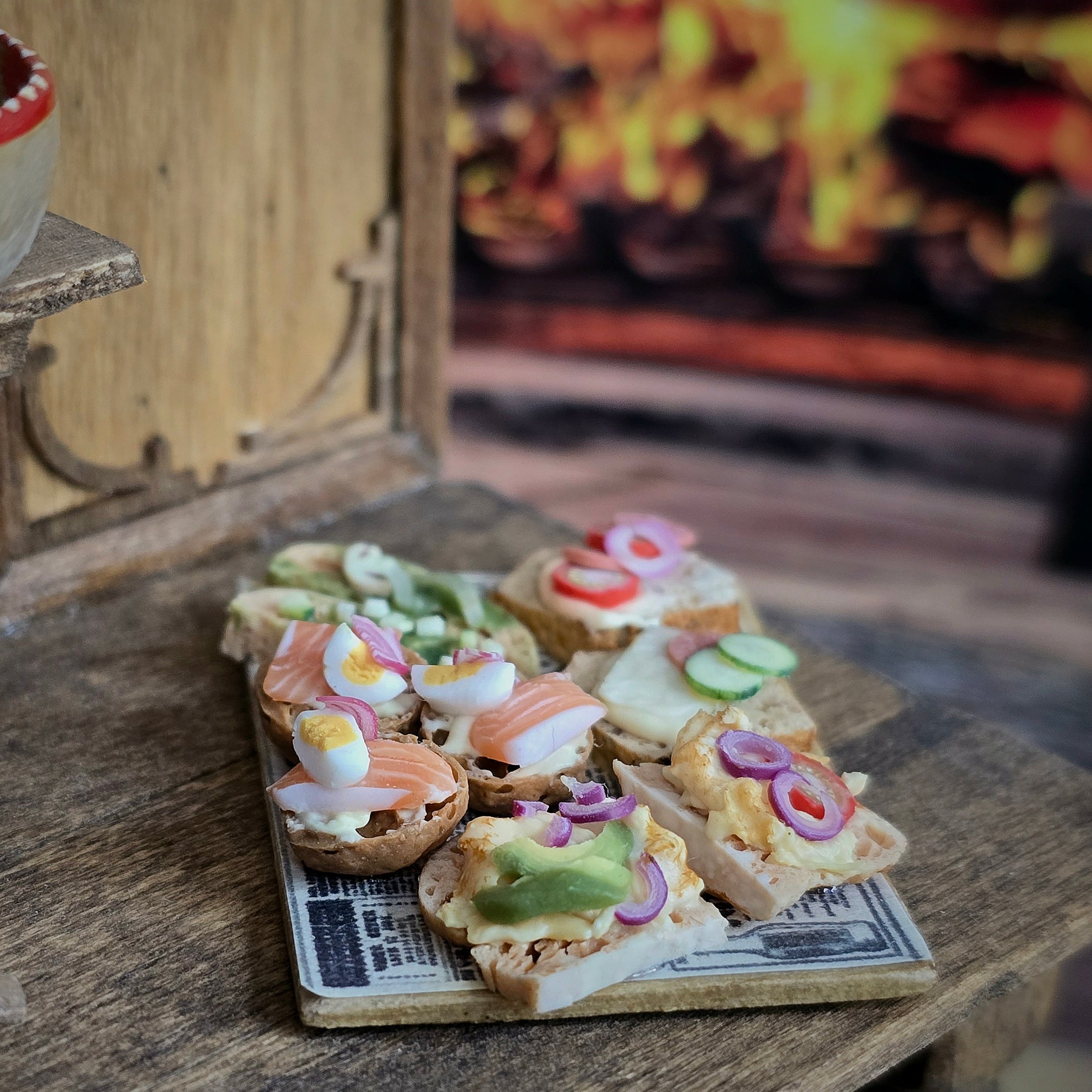 Small sandwiches with various toppings on a wooden board in front of a fireplace.