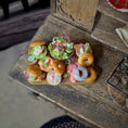 Load image into Gallery viewer, Brunch Bagel Charcuterie Serving Board on a rustic table

