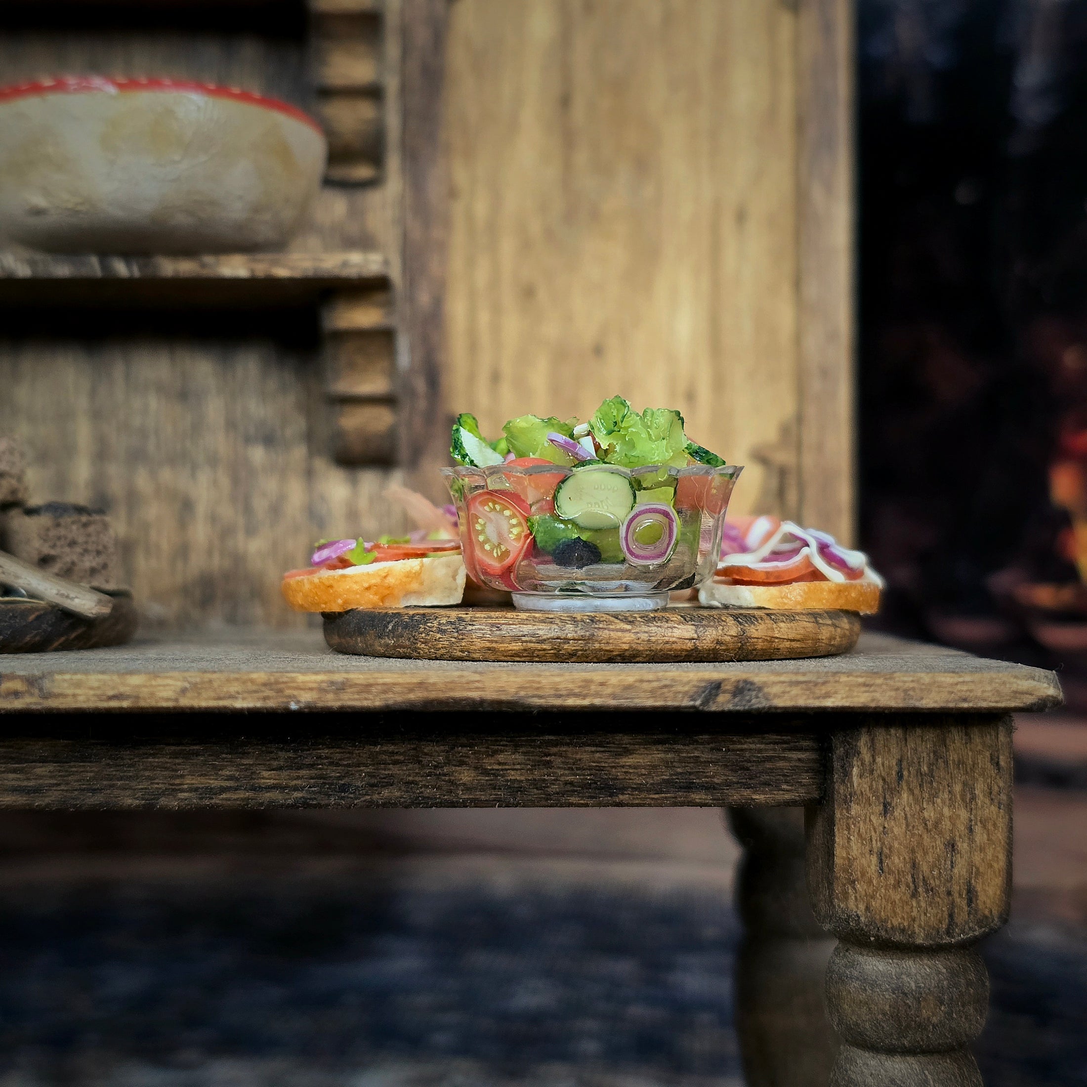 Plated salad with bread slices dressed with vegetables, presented on a rustic wooden board