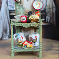 Load image into Gallery viewer, Decorative shelf with ceramic items including vases, bowls, and a rooster figurine.
