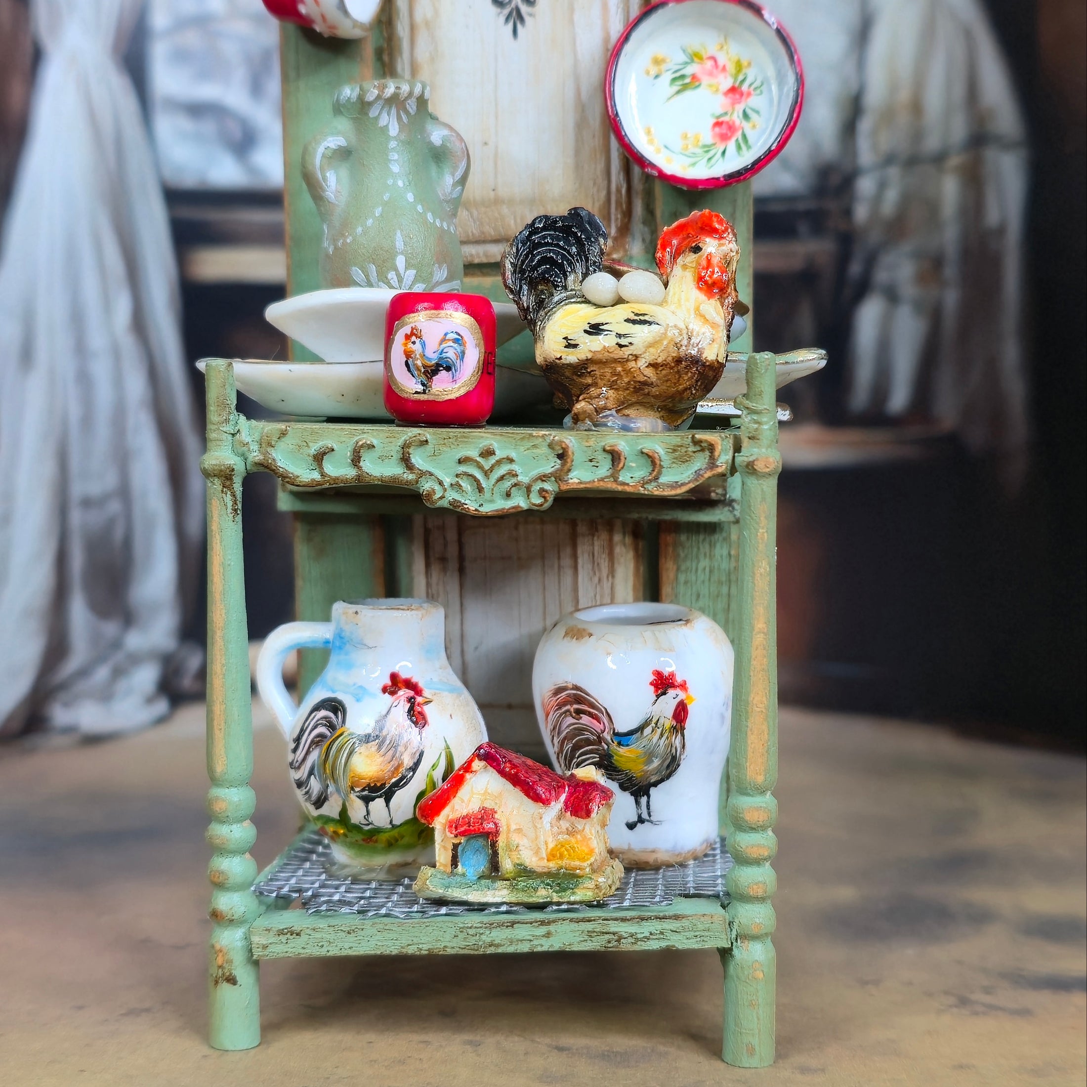 Decorative shelf with ceramic items including vases, bowls, and a rooster figurine.