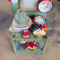 Load image into Gallery viewer, Miniature ceramic items including rooster, and other decorative pieces on a stand.
