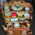 Load image into Gallery viewer, Miniature wooden kitchen set with ceramic items and rooster design on a dark background
