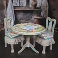 Load image into Gallery viewer, Miniature table and chairs with a decorative tablecloth in a softly blurred background

