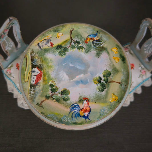 Decorative plate with a rooster and landscape design on a dark background