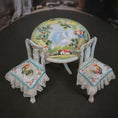 Load image into Gallery viewer, Miniature table and chairs with rooster design on a dark surface
