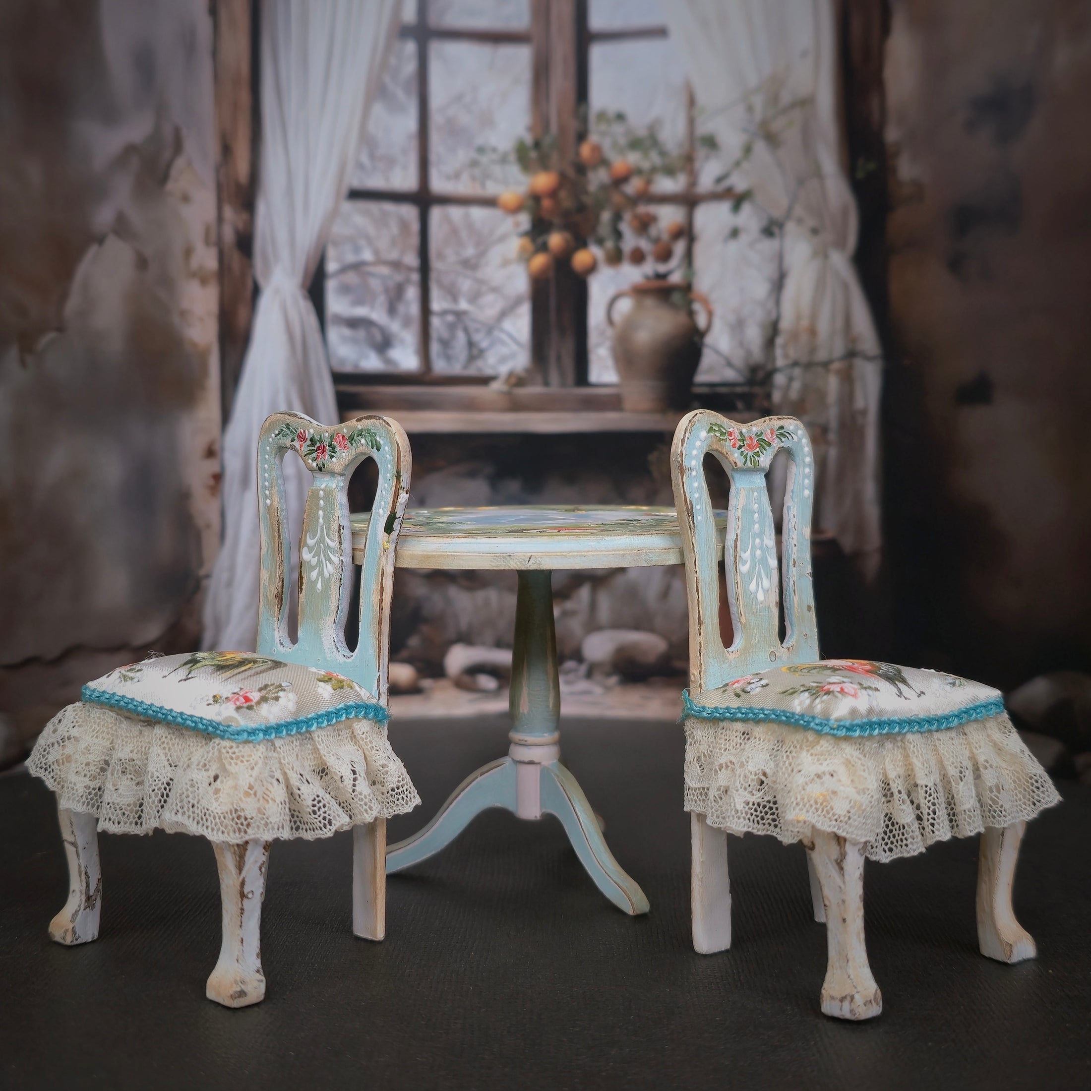 Two ornate chairs with lace cushions in a softly blurred room setting.