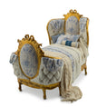 Load image into Gallery viewer, Decorative bed with gold frame and blue toile cushions on a white background
