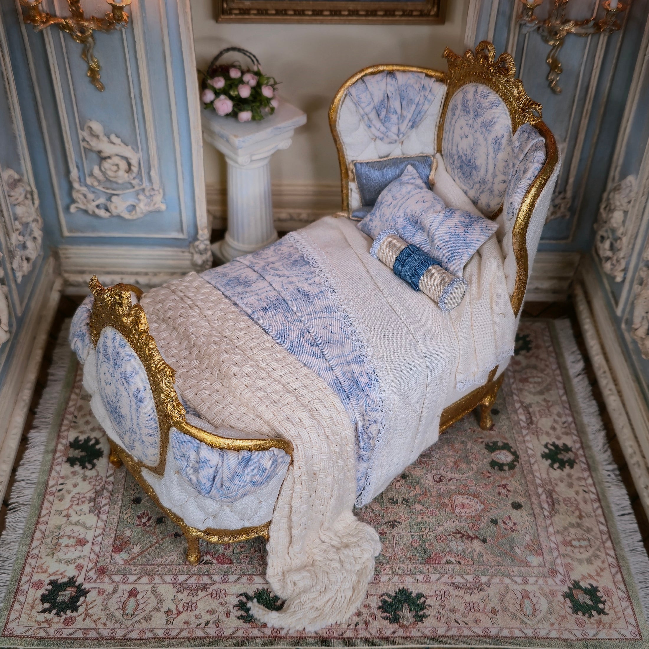 Decorative bedroom with ornate bed and intricate wall details
