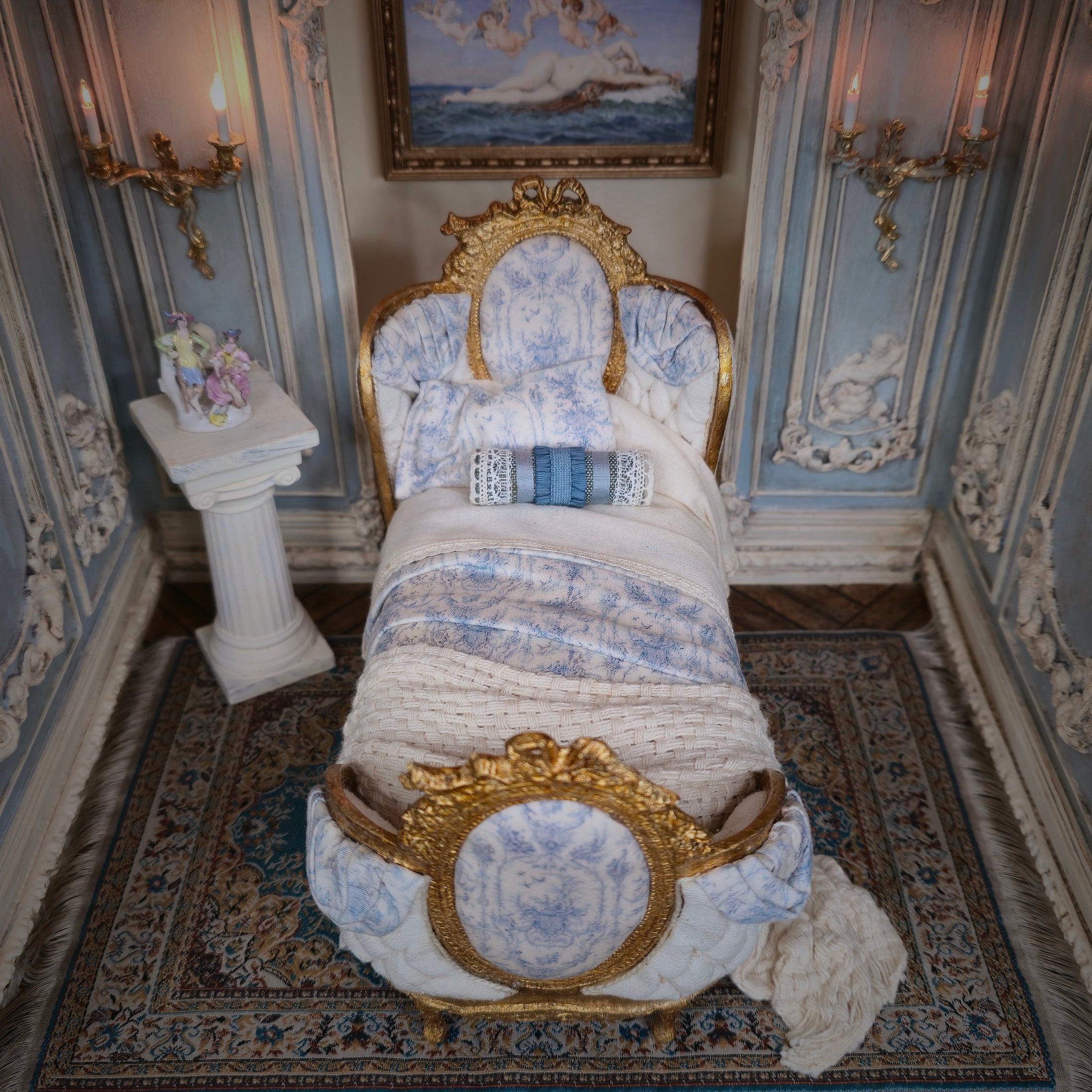 Decorative bed with gold and blue accents in an ornate room.