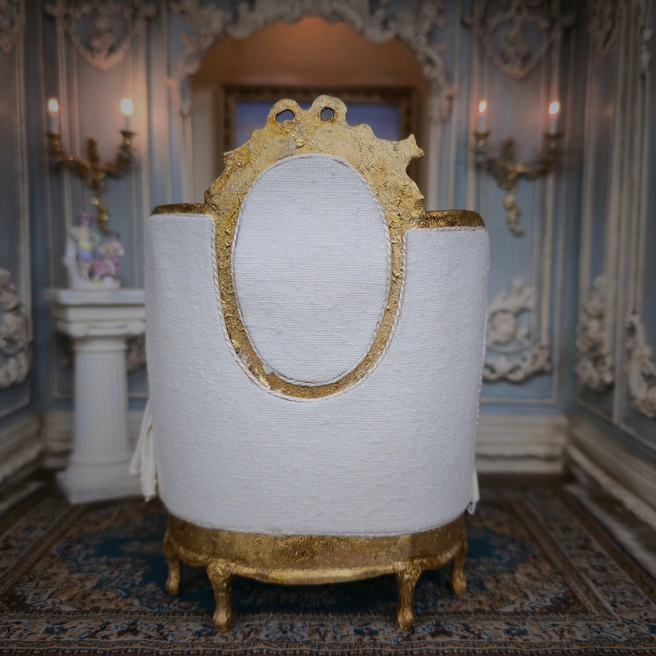 Decorative bed from bckside with gold accents in an ornate room