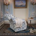 Load image into Gallery viewer, Decorative armchair with blue toile pattern in a room with striped walls and a small table.
