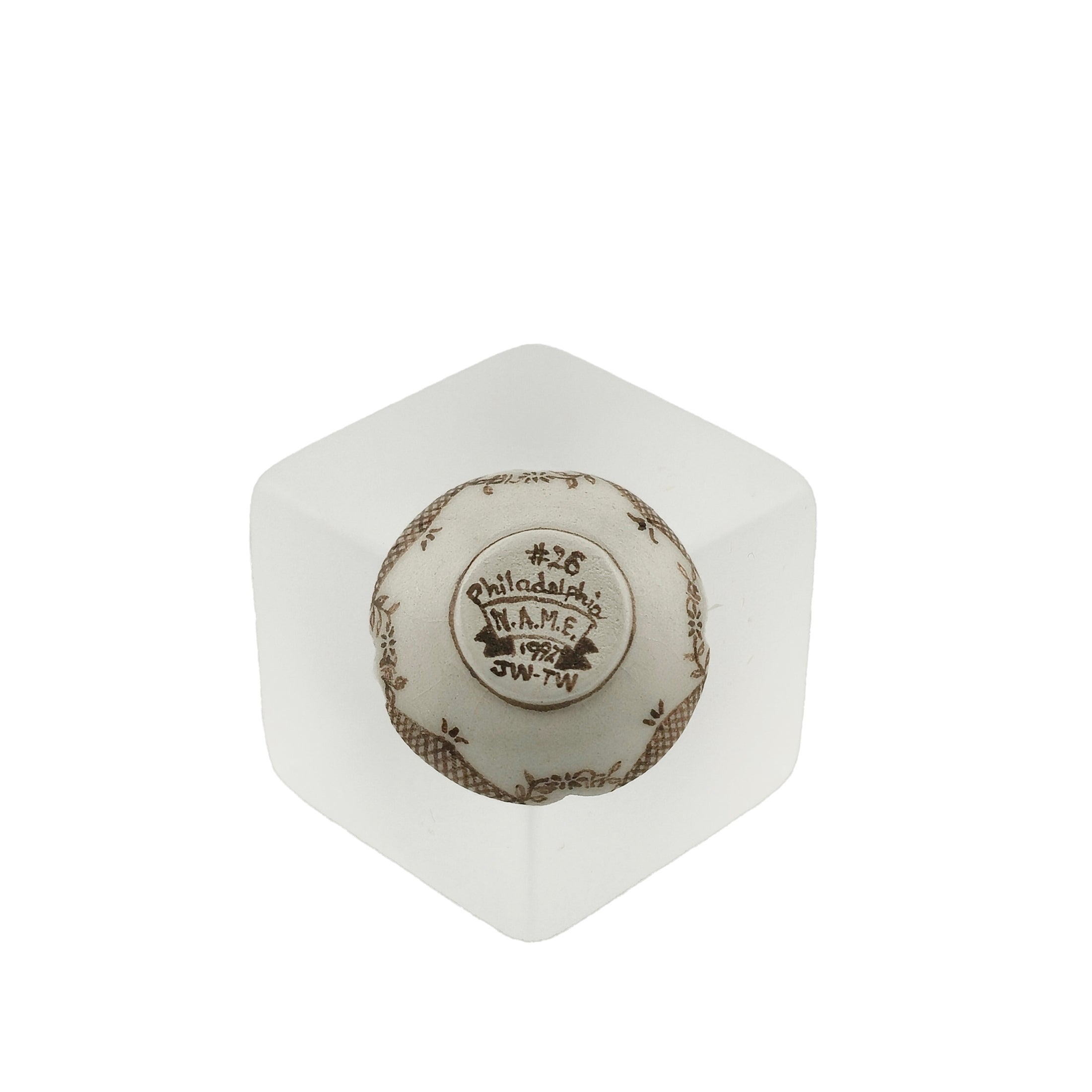 underside of signed bowl on white background