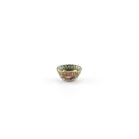 Painted porcelain miniature bowl on white background