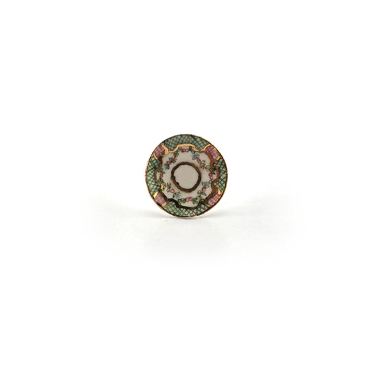 Decorative saucer with floral pattern on a white background