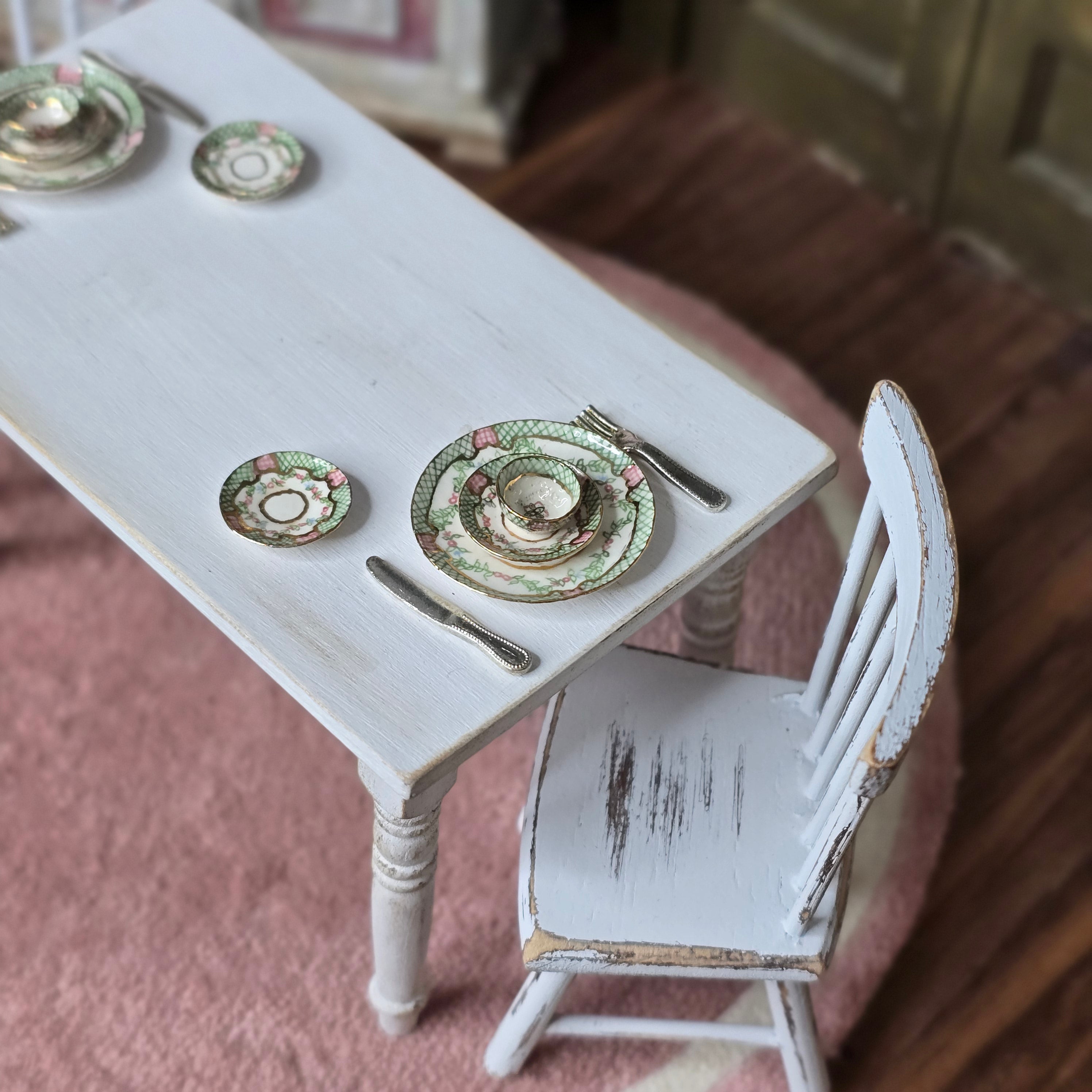 Close-up of a place setting on a white table.