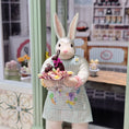 Load image into Gallery viewer, Paris Miniatures Chocolate Easter Rabbit Family Candy Display on Pink Glass Stand
