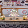 Load image into Gallery viewer, Putz-Style Easter House on Glass Cake Stand Spring Candy Cottage Vintage Artisan
