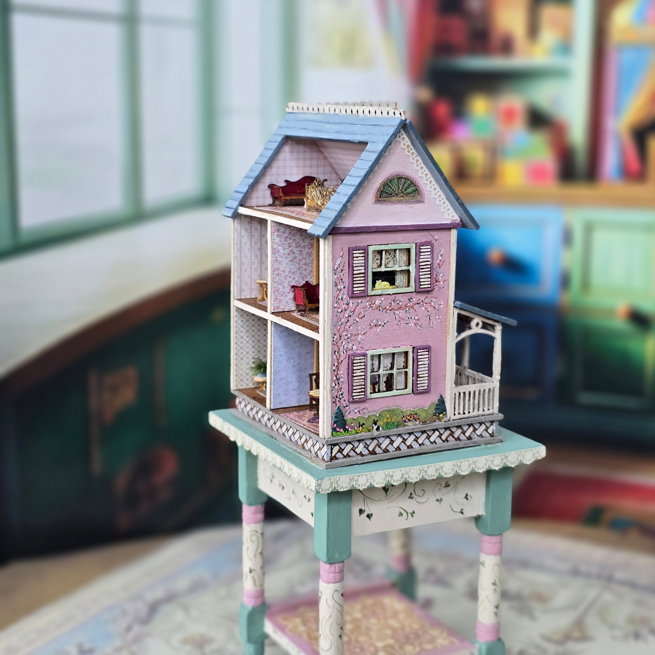 Laura Eppich 1:144 Lavender & Blue Three-Story Victorian Dollhouse on Blue Table