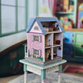 Load image into Gallery viewer, Laura Eppich 1:144 Lavender & Blue Three-Story Victorian Dollhouse on Blue Table
