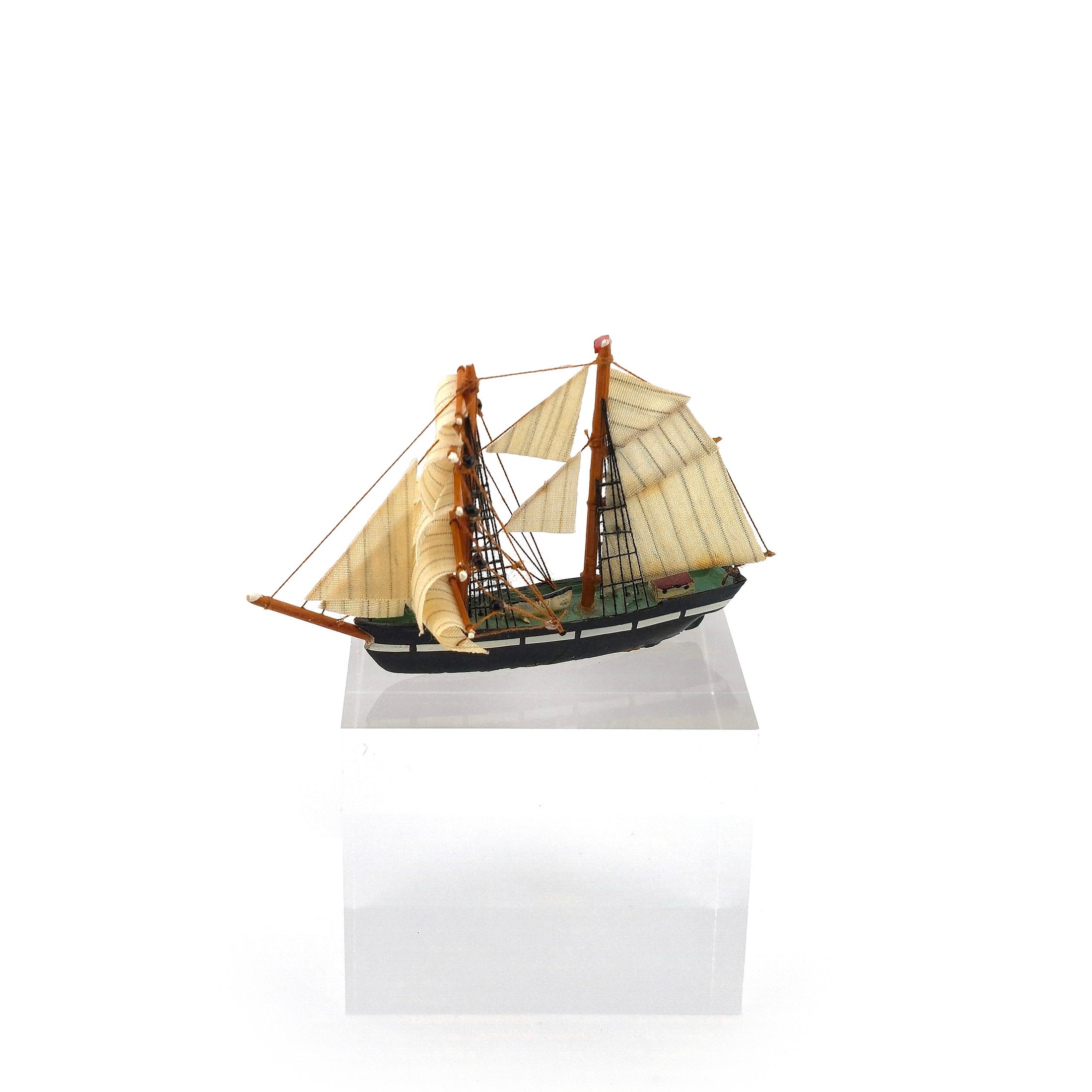 Vintage Artisan Hand-Carved Sailing Ship Miniature with Fabric Sails