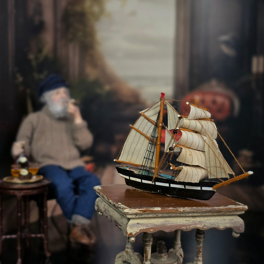 Vintage Artisan Hand-Carved Sailing Ship Miniature with Fabric Sails