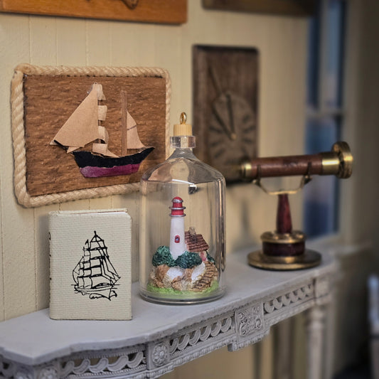 Mosaic Press Scrimshaw Book and Lighthouse in Bottle Nautical Display